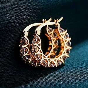 Sterling Silver with gold plating with CZ clear.